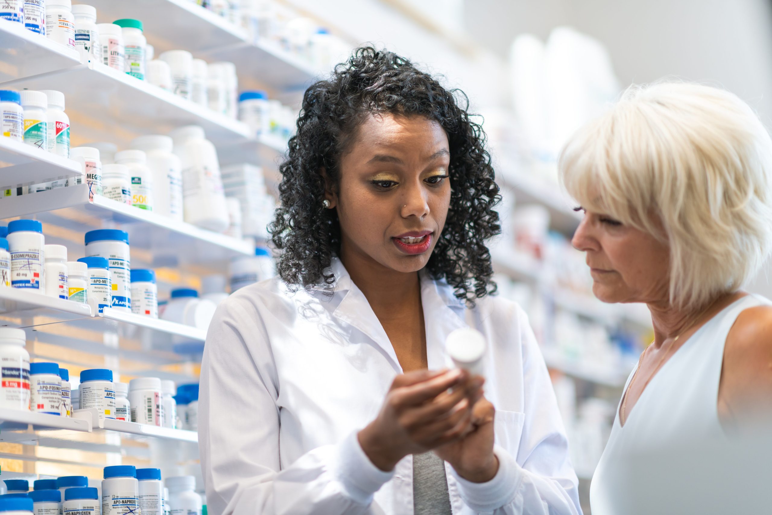 pharmacist helping customer