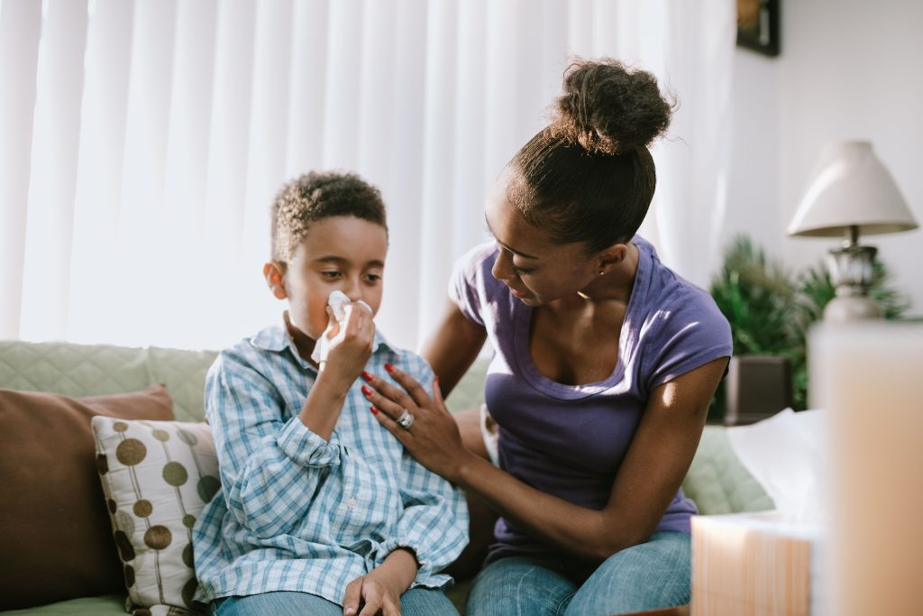 mother tending to sick child