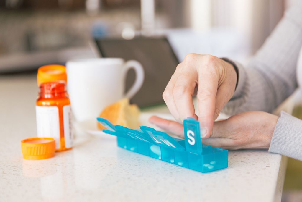 woman organizing medication