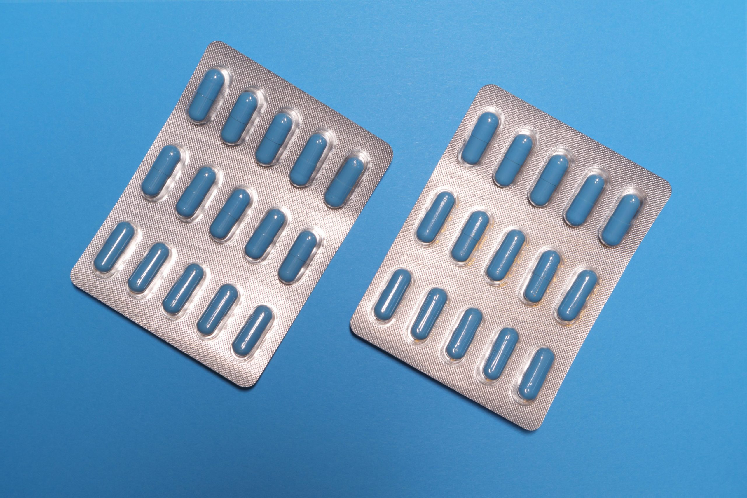 blister packs on a blue background