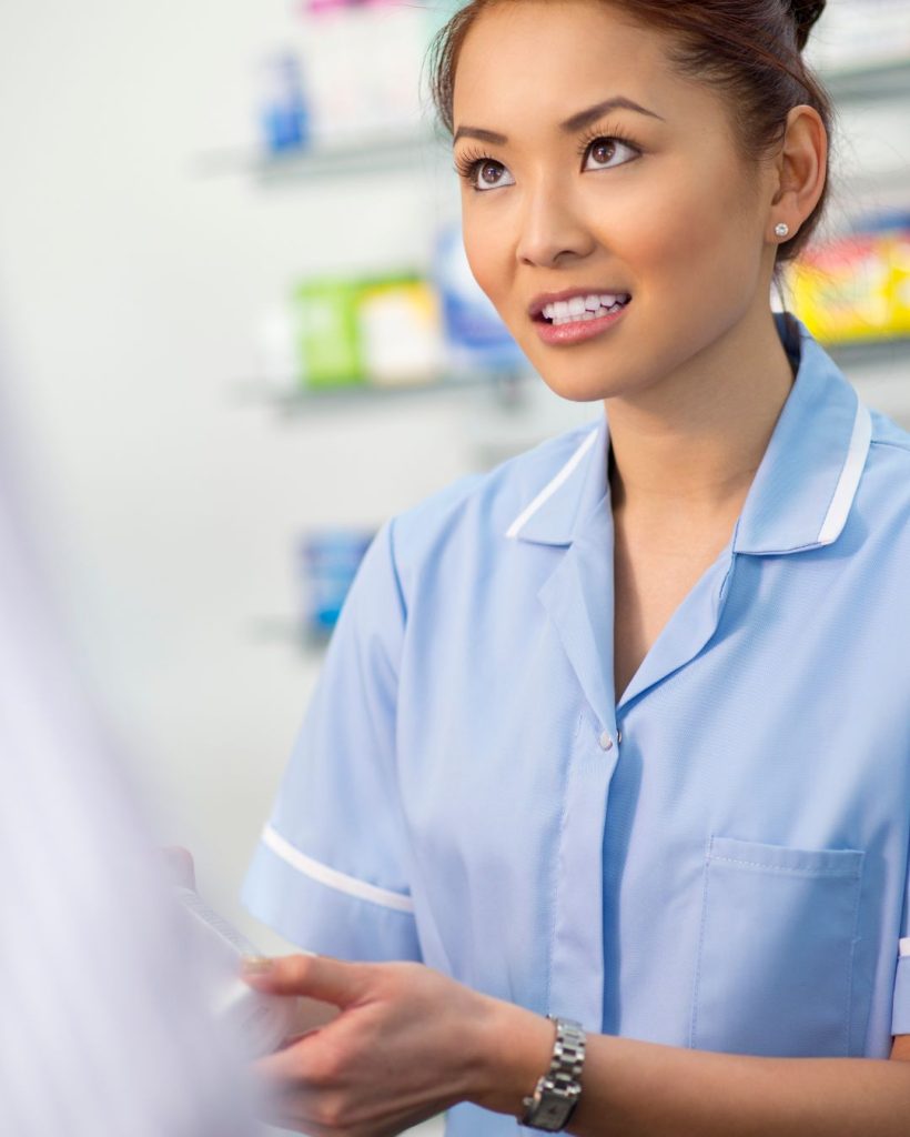 pharmacist attending customer